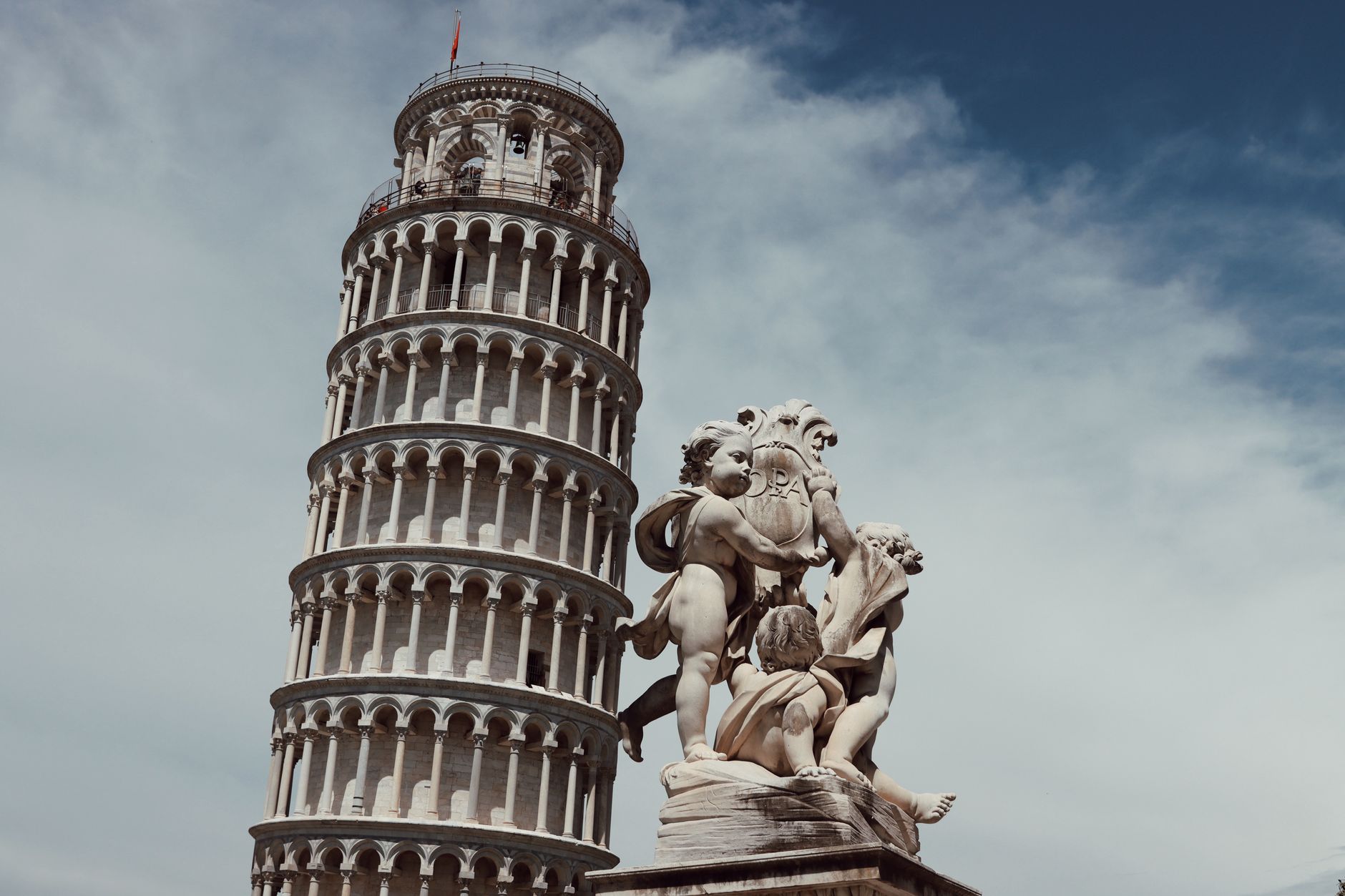Indian students near Leaning Tower of Pisa with University of Pisa aerospace engineering campus