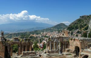 Indian students living in Sicily near Mount Etna choosing between Catania and Messina university