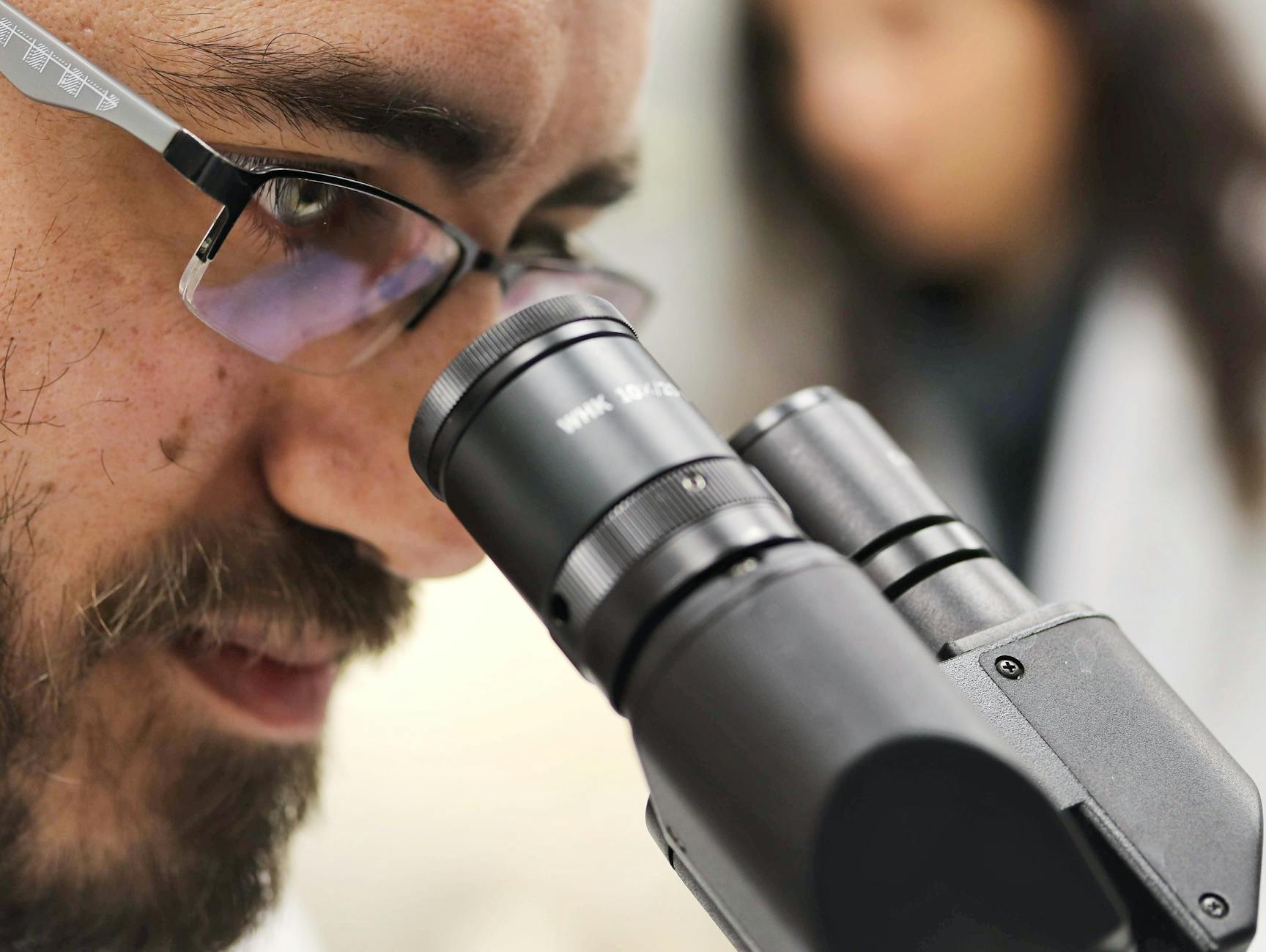 International student building research career in Italy at university laboratory working on funded project
